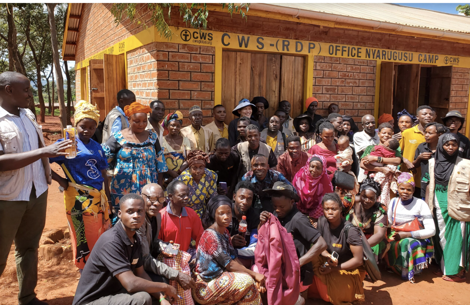 a group of Congolege refugees pose for a photograph at the Nyarugushu refugee camp